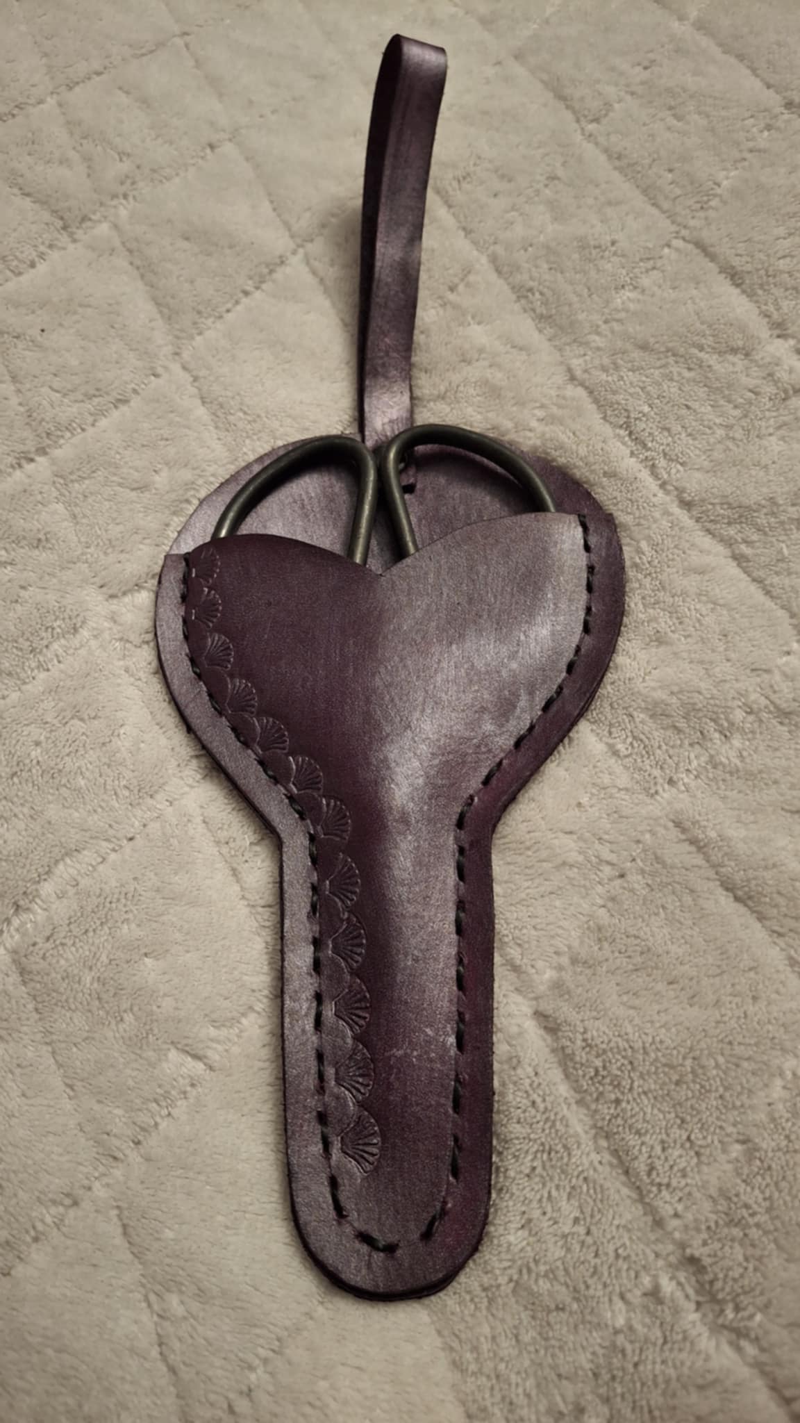 Small scissors with leather holder